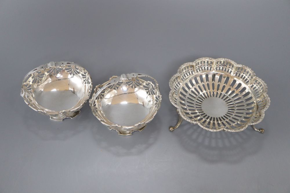 A pair of George V pierced silver bonbon baskets, Birmingham, 1913 and an Edwardian pierced silver dish, London, 1908,